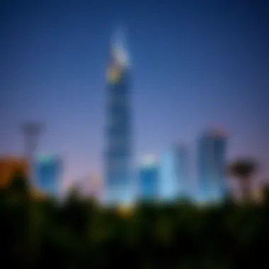 Nighttime view of Aneeqa Tower illuminated against the Dubai skyline