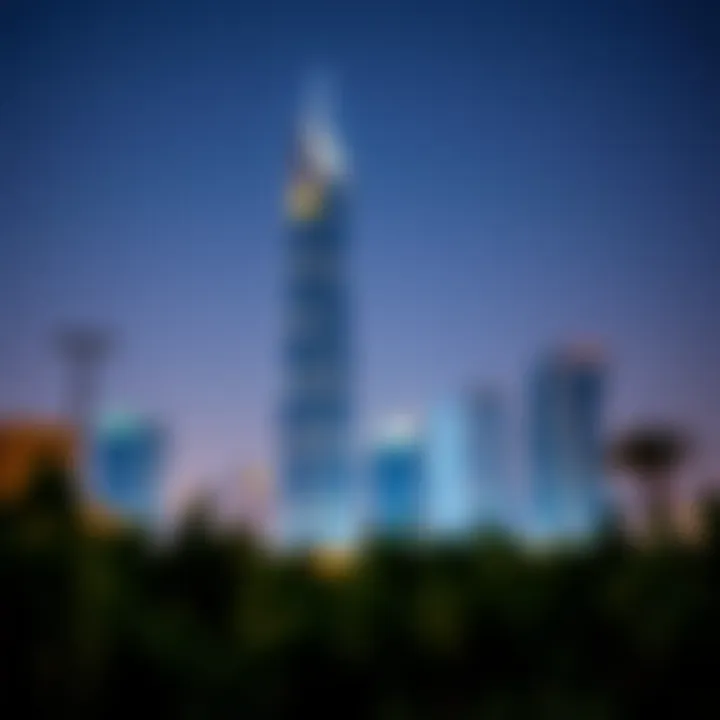 Nighttime view of Aneeqa Tower illuminated against the Dubai skyline