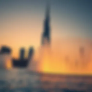 The fountain system with the Burj Khalifa tower in the background during sunset
