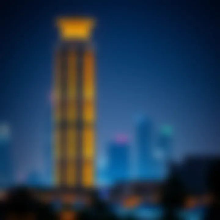 Windsor Manor Tower illuminated at night against the Dubai skyline