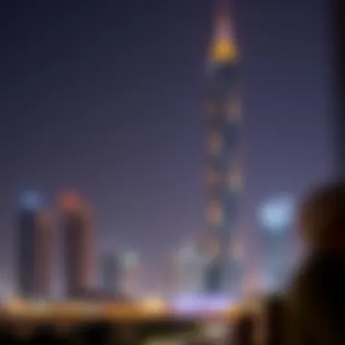 Night view of Al Thuraya Tower illuminated against the Dubai skyline